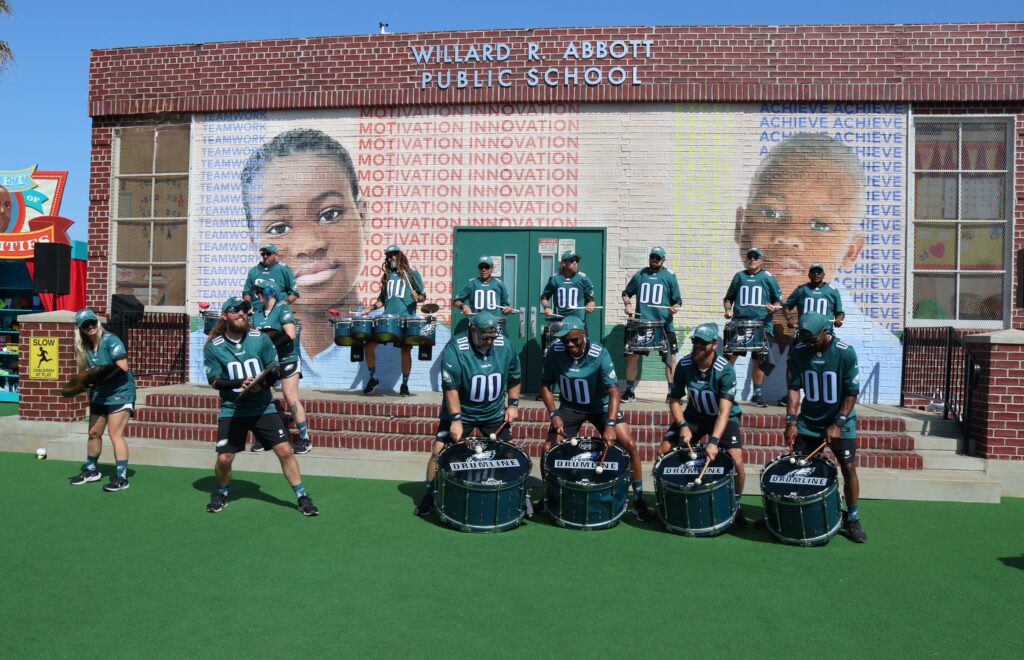 Drumline in front of the Abbott Elementary replica at AVA Fest at SDCC 2024
