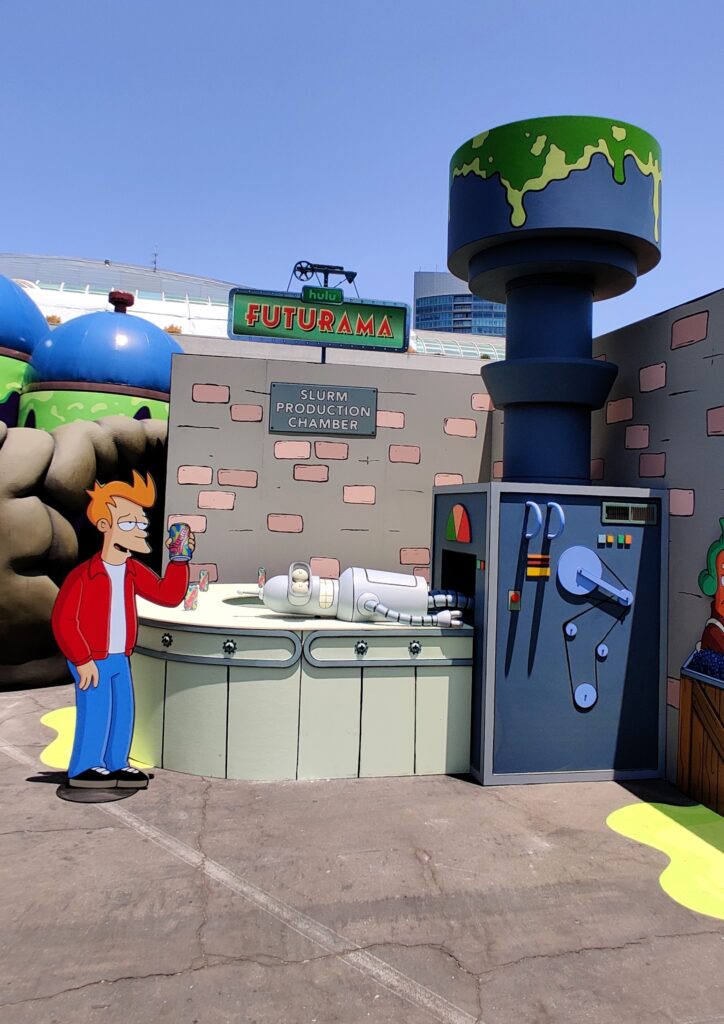 Futurama’s Fry and Bender at the Slurm Factory in Hulu Animayhem’s off-site at SDCC 2024
